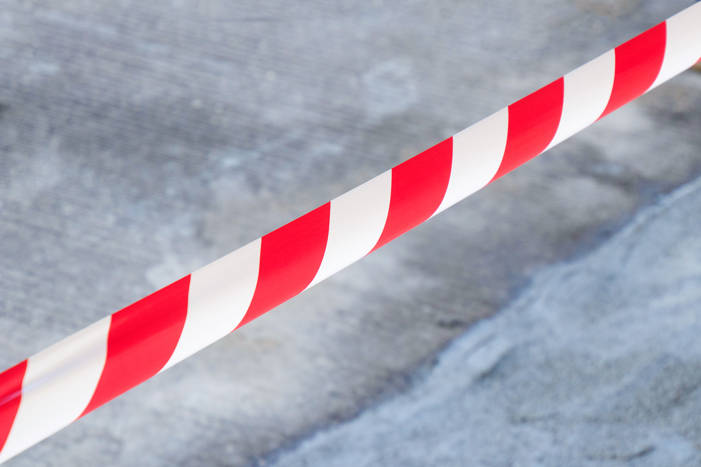 Red and White Lines of barrier tape.